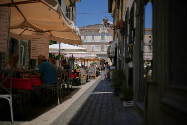Customers have lunch at restaurants in the town of Castel Gandolfo, a historic summer retreat for popes about 30 kilometers southeast of Rome, where Pope Leo XIV will be spending a short period of rest, as seen Wednesday, July 2, 2025. (AP Photo/Andrew Medichini)