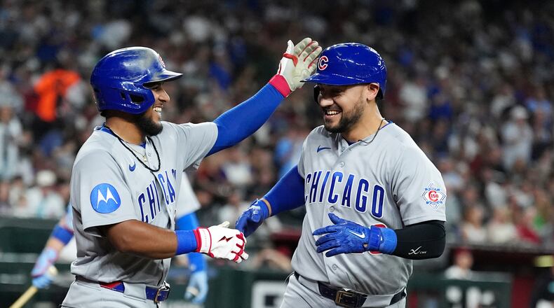 Chicago Cubs' Michael Conforto, right, celebrates his two-run home run against the Arizona Diamondbacks with Cubs' Pedro Ramírez during the sixth inning of a baseball game, Monday, Aug. 24, 2026, in Phoenix. (AP Photo/Ross D. Franklin)