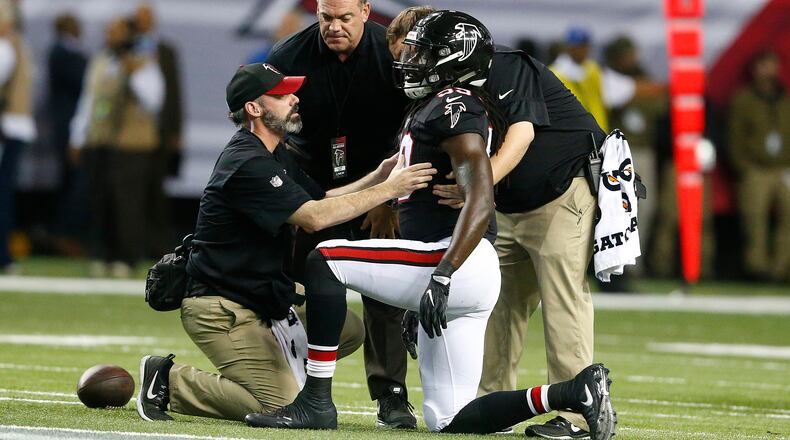 Atlanta Falcons outside linebacker De'Vondre Campbell is helped after being injured against the San Francisco 49ers during the first half Sunday, Dec. 18, 2016, in Atlanta.