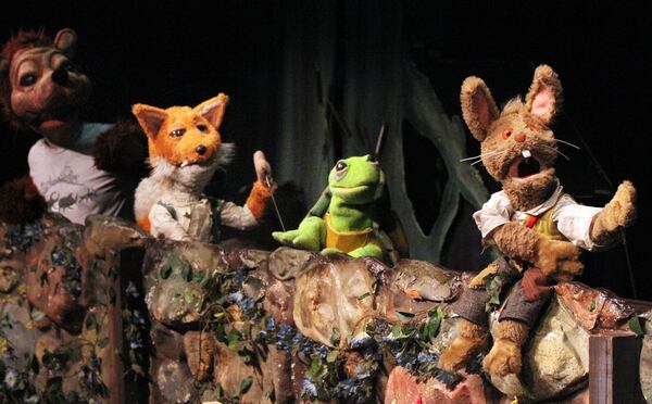 (From left) Tim Sweeney (as Br’er Bear), Dolph Amick (Br’er Fox), Janee Ann Smith (Br’er Turtle) and Jared Brodie (Br’erRabbit) perform during rehearsals for The Center for Puppetry Arts' production of "Br’er Rabbit & Friends."