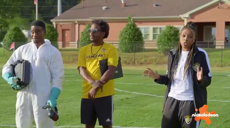 Kel Mitchell (left) and Renee Montgomery (right) help Sporting Club Stockbridge Soccer Academy and coach Damian Thompson during the first episode of Nickelodeon's “Play It Forward,” shot in metro Atlanta. (Nickelodeon)