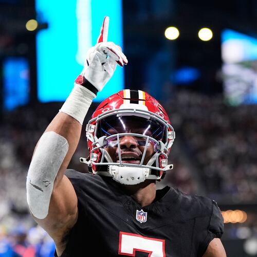 FILE - Atlanta Falcons running back Bijan Robinson (7) celebrates his touchdown reception against the Los Angeles Rams in the first half of an NFL football game, Dec. 29, 2025, in Atlanta. (AP Photo/Brynn Anderson, File)