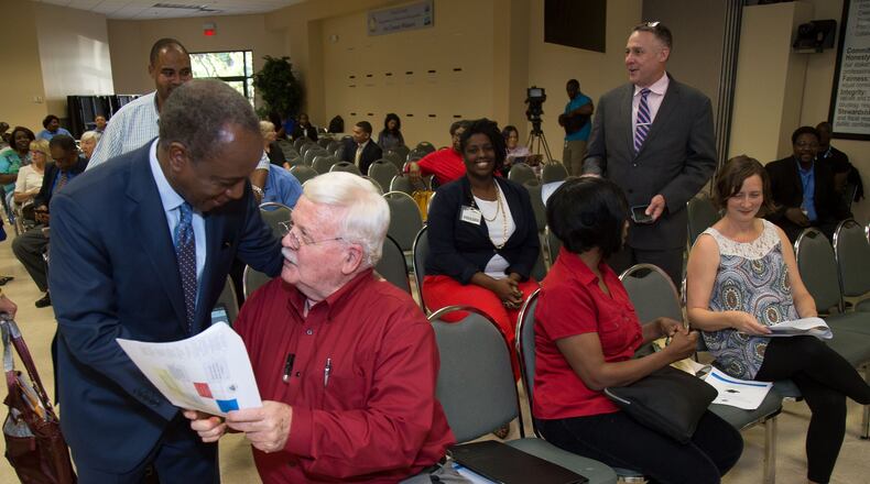 DeKalb CEO Michael Thurmond (left) talks to Joe Arrington, a DeKalb home owner, before a meeting addressing the most recent steps the county has taken to resolve the water billing crisis at the Maloof Auditorium in Decatur on Tuesday, April 11, 2017. STEVE SCHAEFER / SPECIAL TO THE AJC