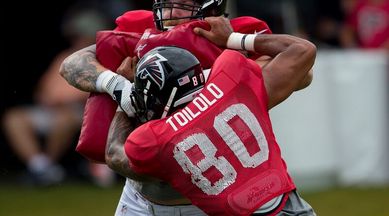 Falcons offensive tackle Andreas Knappe works against tight end Levine Toilolo (80) during the team's NFL training camp football practice Wednesday.