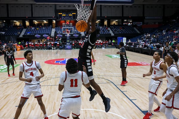 Tri-Cities forward Jalan Wingfield dunks during the first half against Woodward Academy in the GHSA Boys 5A State Championship at the Macon Centreplex, Friday, March, 7, 2025, in Macon, Ga. Tri-Cities won 66-55. (Jason Getz/AJC)