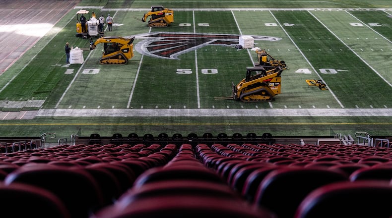 Work began Thursday on removing the artificial turf at Mercedes-Benz Stadium. A new turf will be installed over the next two weeks. (Photo by Dakota Williams/AMB Sports & Entertainment)