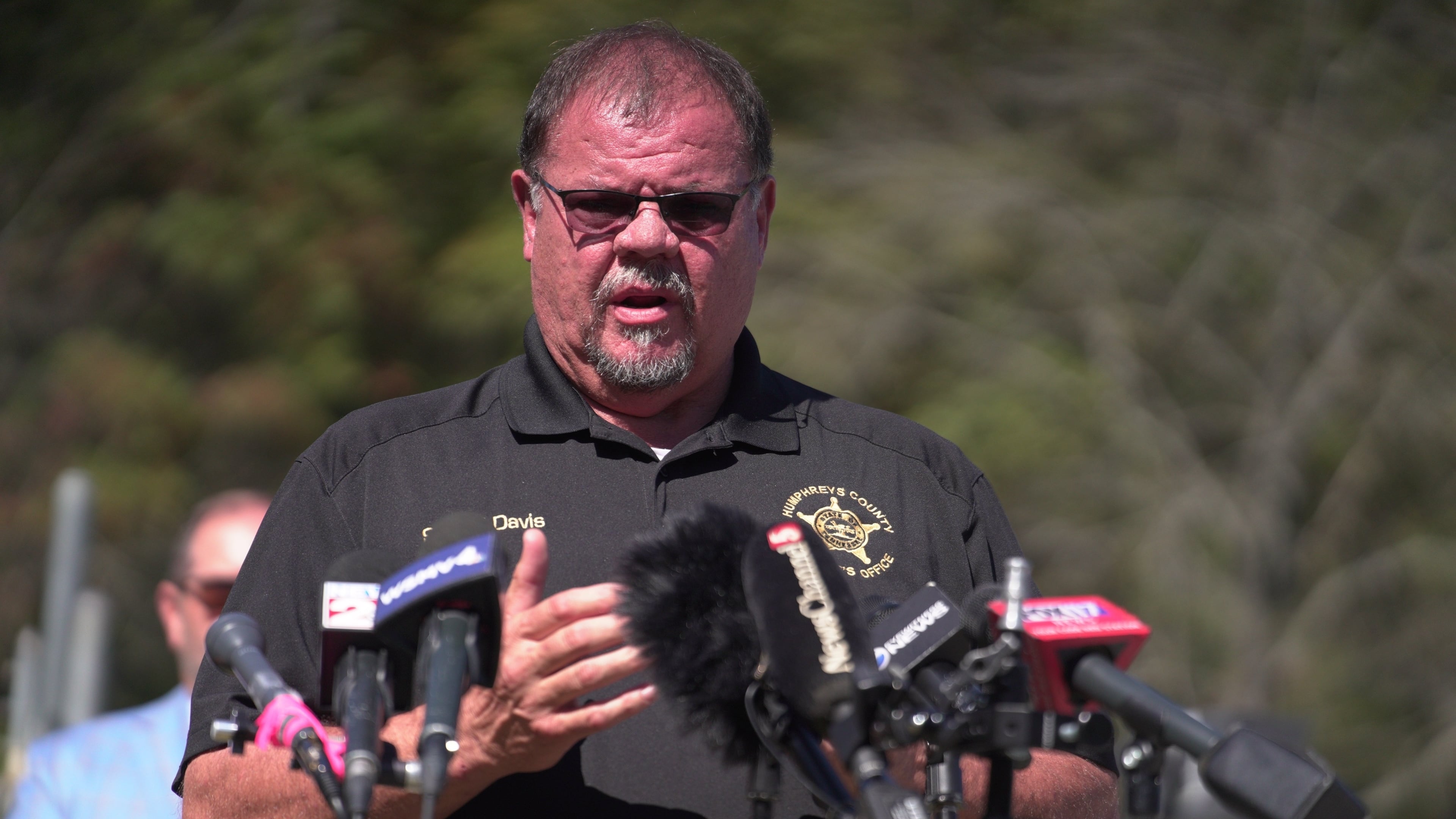 Humphreys County Sheriff Chris Davis, right, speaks during a news conference Monday, Oct. 13, 2025, in McEwen, Tenn., at Accurate Energetic Systems. (AP Photo/Obed Lamy)