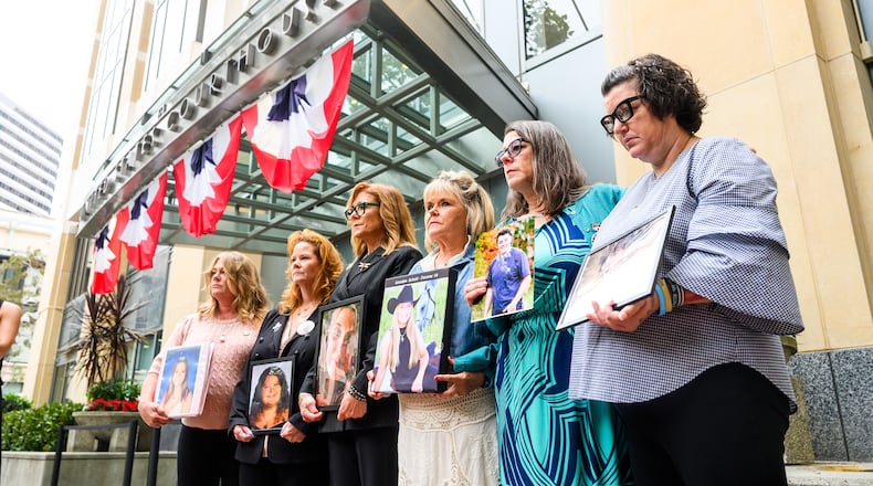 Parents hold pictures of their deceased children during a protest against social media platforms outside the Ronald V. Dellums Federal Building and U.S. Courthouse on Tuesday, Aug. 18, 2026, in Oakland, Calif. (AP Photo/Noah Berger)