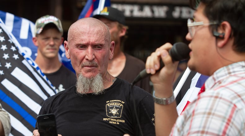 Chester Doles (left), believes federal authorities will use the pandemic to restrict gun rights. STEVE SCHAEFER / SPECIAL TO THE AJC