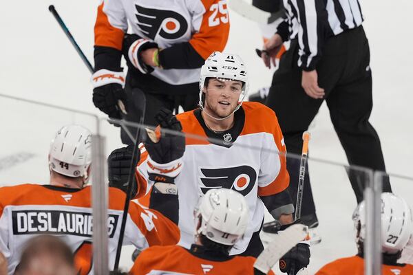 Philadelphia Flyers' Tyson Foerster (71) celebrates with teammates after scoring an empty-net goal during the third period of an NHL hockey game against the New York Rangers Wednesday, April 9, 2025, in New York. (AP Photo/Frank Franklin II)
