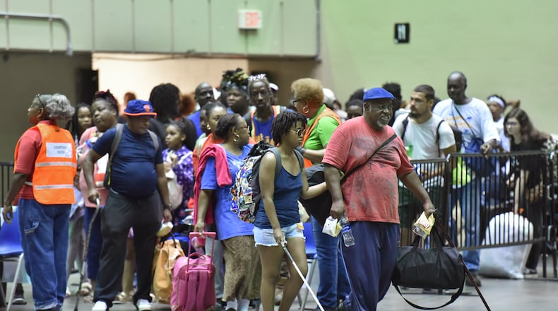 September 3, 2019 Savannah - Local residents go inside the Savannah Civic Center to get a free transportation to inland shelters under mandatory evacuation ahead of Hurricane Dorian on Tuesday, September 3, 2019. Chatham Area Transit (CAT) provided free transportation to residents without private transportation to the Savannah Civic Center to assist in the mandatory evacuation of Chatham County. (Hyosub Shin / Hyosub.Shin@ajc.com)