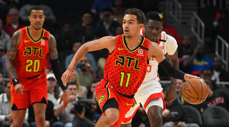 Atlanta Hawks guard Trae Young (11) races upcourt during the first half of an NBA basketball game against the Houston Rockets, Wednesday, Jan. 8, 2020, in Atlanta. (AP Photo/John Amis)