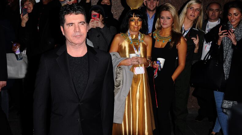 LONDON, ENGLAND - DECEMBER 03: Simon Cowell attends The Annual ICAP Charity Day at ICAP on December 3, 2014 in London, England. (Photo by Stuart C. Wilson/Getty Images) LONDON, ENGLAND - DECEMBER 03: Simon Cowell attends The Annual ICAP Charity Day at ICAP on December 3, 2014 in London, England. (Photo by Stuart C. Wilson/Getty Images)