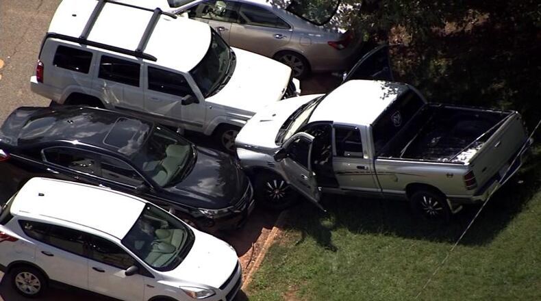 There was anti-Atlanta Police Department graffiti inside a stolen vehicle that crashed into employee vehicles at Thomasville Heights Elementary School. (Credit: Channel 2 Action News)
