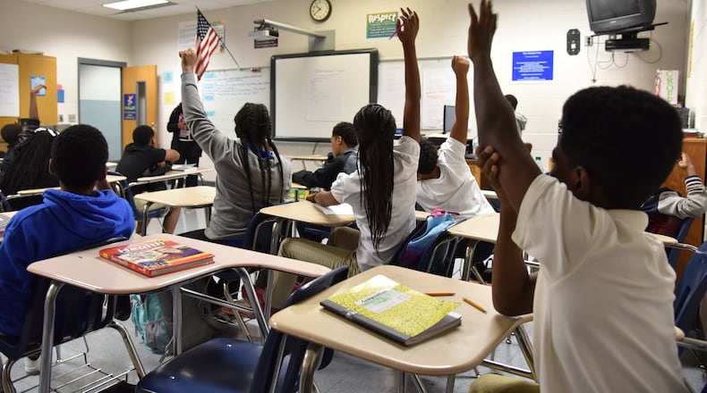 Tavonne Johnson answers questions from students during a middle school sex education class at Stephenson Middle School in DeKalb County. DeKalb uses a comprehensive- based curriculum known as FLASH, which is endorsed by healthcare advocates. The school system dropped the controversial, abstinence based curriculum know as "Choosing the Best" nearly 10 years ago after parents criticized the program fro not fully informing students. Fulton County is now considering adopting the "Choosing the Best" program.