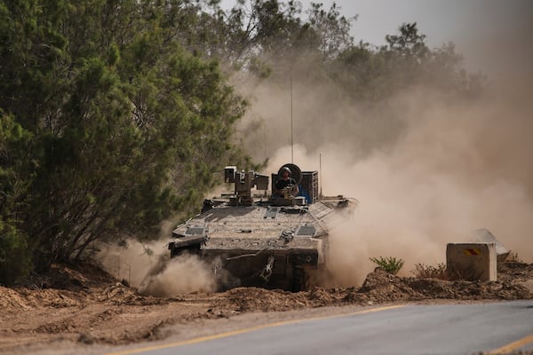 Israeli forces move along the border with the Gaza Strip, in southern Israel, Monday, May 19, 2025. (AP Photo/Ohad Zwigenberg)