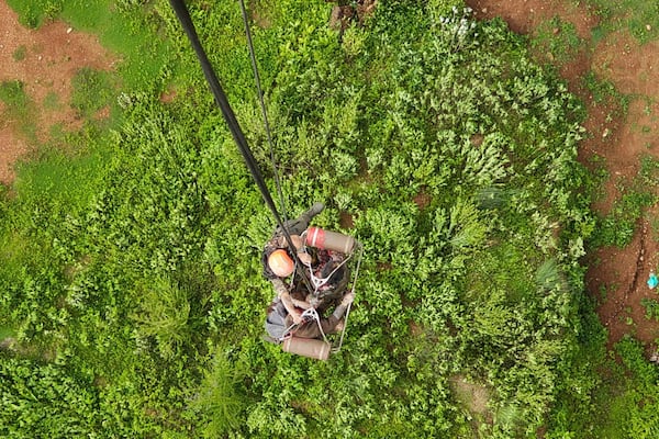 Army personnel rescue people stranded by the flooding on the Bhotekoshi River 120 kilometers (75 miles) north of Kathmandu, Nepal, Tuesday, July 8, 2025. (Nepal Army via AP)