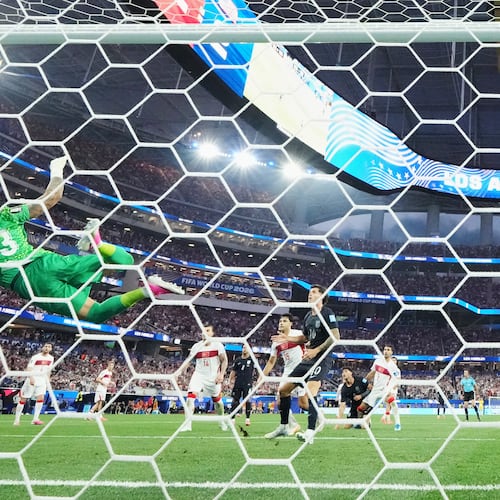Tunisia's Moutaz Neffati (23) makes a diving save on a shot by United States' Christian Pulisic (10) during the World Cup Group D soccer match between Turkey and the United States in Inglewood, Calif., near Los Angeles, Thursday, June 25, 2026. (AP Photo/Andre Penner)