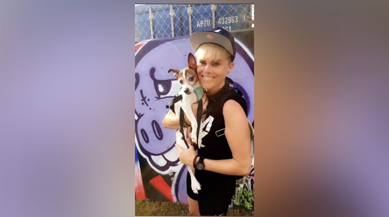 Austin and owner, Lauren Carroll. Austin has been missing for a week since the 2014 black Ford Explorer in which he was riding was stolen in East Atlanta. HANDOUT