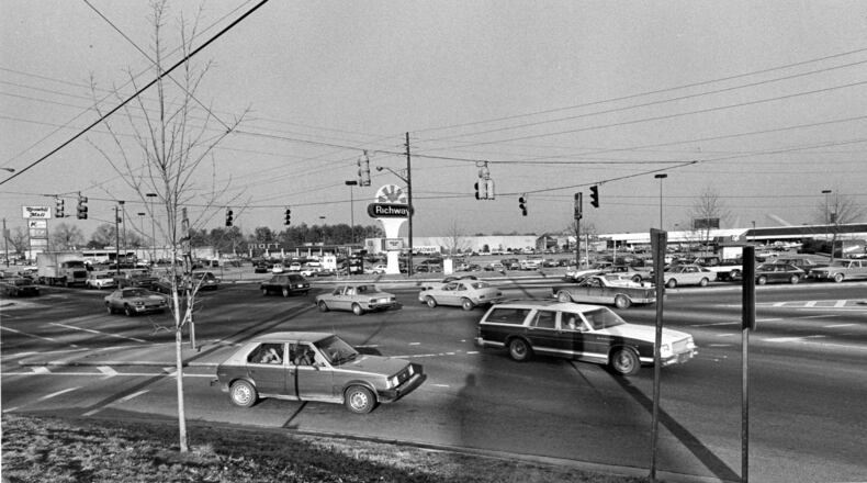 Traffic crosses Alpharetta Street and Holcomb Bridge Road, with Roswell Mall in the background, in this photo from Jan. 29, 1985. Roswell plans a series of virtual workshops beginning Thursday, Oct. 29, on future development along Holcomb Bridge for its 2040 Comprehensive Plan. (J.C. Lee / AJC staff)