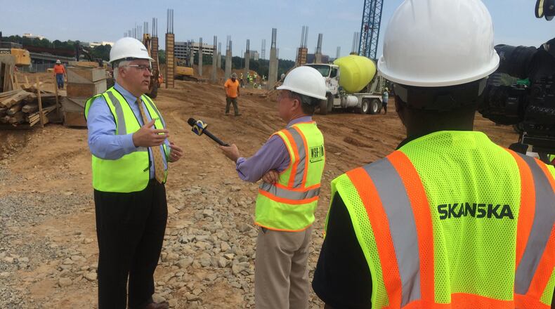 Tim Lee, the incumbent Cobb County Commission chairman, with a TV crew at a construction site this week. Jim Galloway, jgalloway@ajc.com