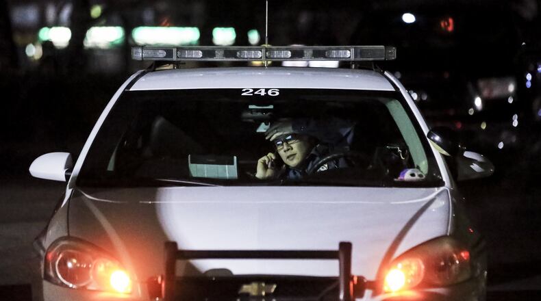 In this Jan. 2018 file photo, Gwinnett County police search for a missing woman near Norcross. JOHN SPINK/JSPINK@AJC.COM