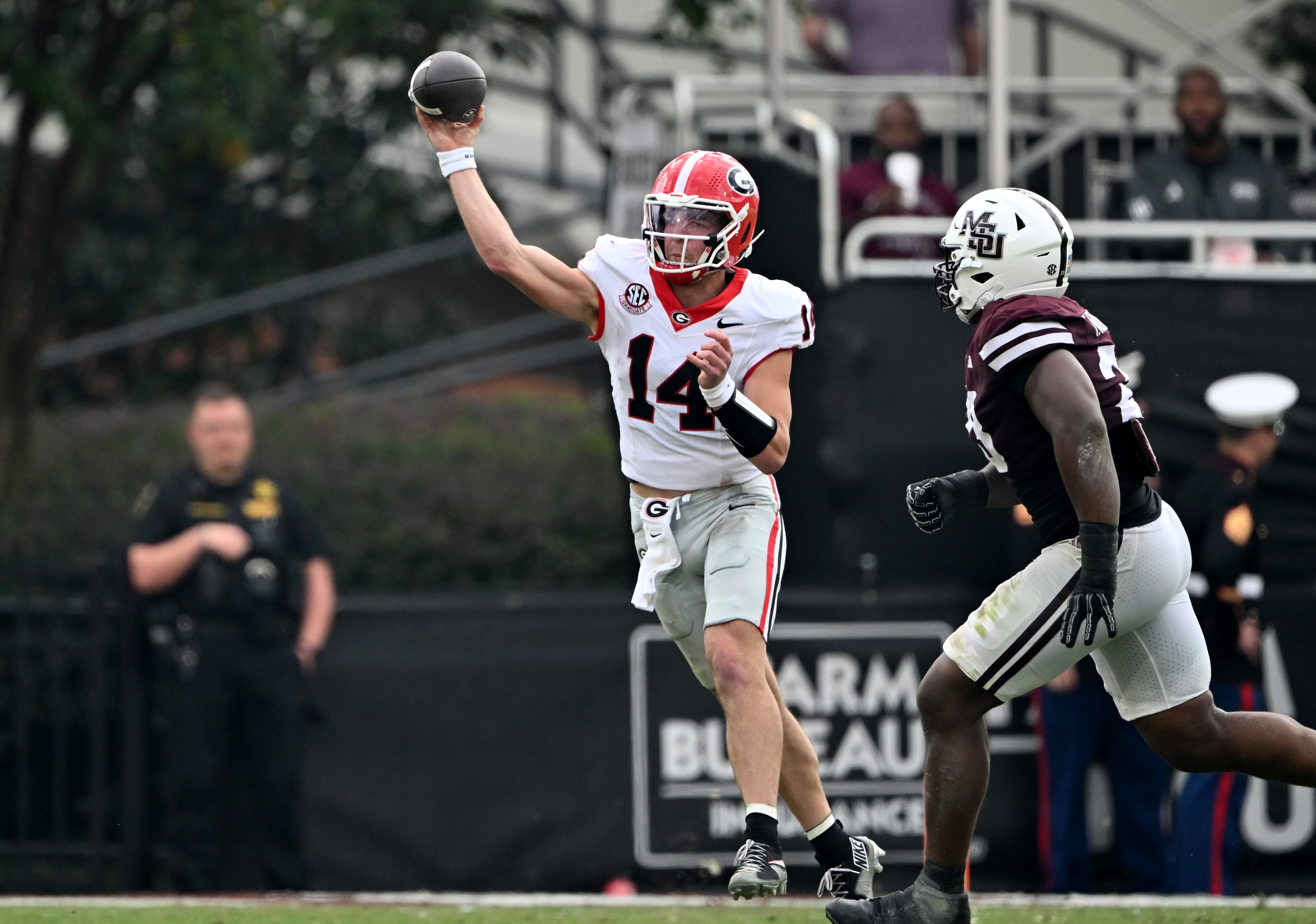 Georgia quarterback Gunner Stockton (14) gets off a pass during the second half in an NCAA football game at Davis Wade Stadium, Saturday, November 8, 2025, in Starkville, Mississippi. Georgia won 41-21 over Mississippi State. (Hyosub Shin / AJC)