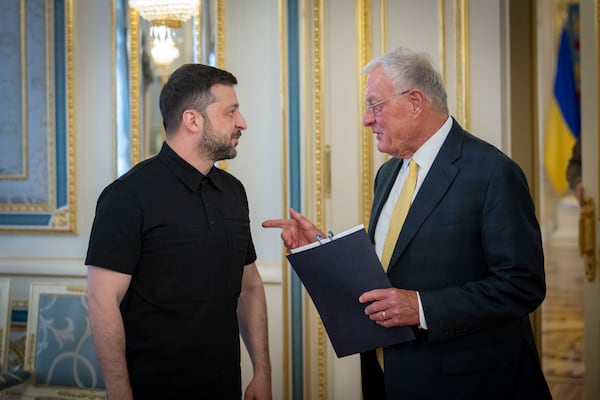 Ukrainian President Volodymyr Zelenskyy, left, and United States Special Envoy for Ukraine and Russia, Joseph Keith Kellogg talk in Kyiv, Ukraine, Monday, July 14, 2025. (Ukrainian Presidential Press Office via AP)