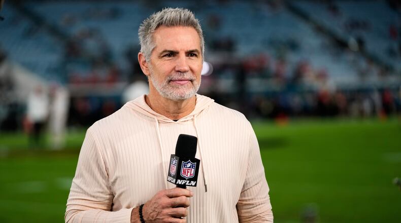FILE - NFL Network analyst Kurt Warner reports before an NFL football game between the Jacksonville Jaguars and the Kansas City Chiefs, Oct. 6, 2025, in Jacksonville, Fla. (AP Photo/John Raoux, File)