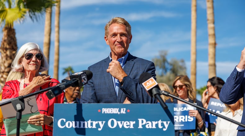 Former Republican Senator and Ambassador Jeff Flake speaks in support of Kamala Harris outside the Indian Bend Wash Visitor Center on October 30, 2024 in Scottsdale, Arizona. Now, Flake has endorsed Democrat U.S Sen. Jon Ossoff against his Republican opponent U.S. Rep. Mike Collins, saying that character matters more than partisan differences. (Gina Ferazzi/Los Angeles Times via Getty Images 2024)