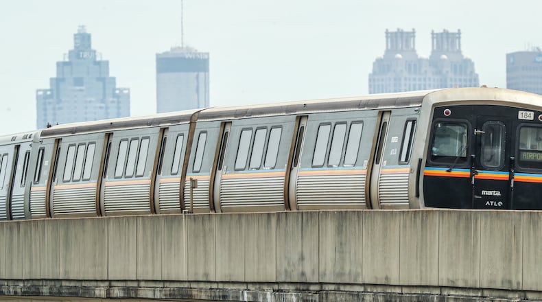 June 3, 2022 Atlanta: A MARTA train makes its way down the South track near Arlington Avenue on Friday, June 3, 2022.  (John Spink / John.Spink@ajc.com)