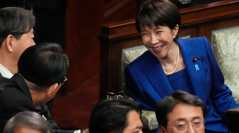 Japanese Prime Minister Sanae Takaichi, right, and other lawmakers speak before dissolving the lower house, during an extraordinary Diet session at the lower house of parliament Friday, Jan. 23, 2026, in Tokyo. (AP Photo/Eugene Hoshiko)