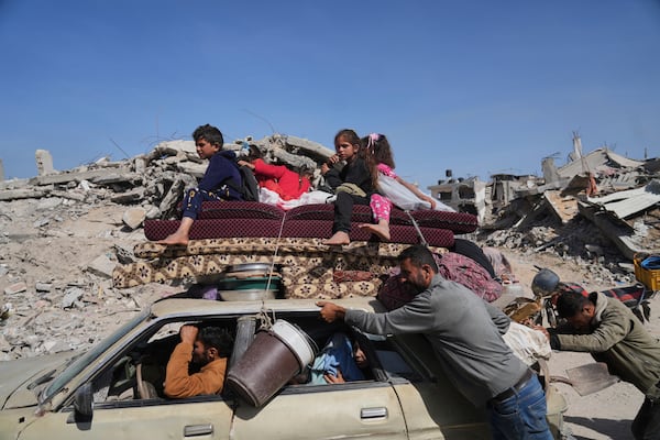 Displaced Palestinians fleeing Beit Lahia amid ongoing Israeli military operations in the Gaza Strip arrive in Jabalia, northern Gaza, on Friday, May 16, 2025. (AP Photo/Jehad Alshrafi)
