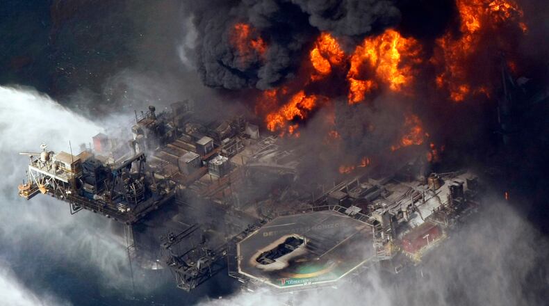 FILE - The Deepwater Horizon oil rig burns on April 21, 2010, in the Gulf of Mexico, more than 50 miles southeast of Venice, La. (AP Photo/Gerald Herbert, File)