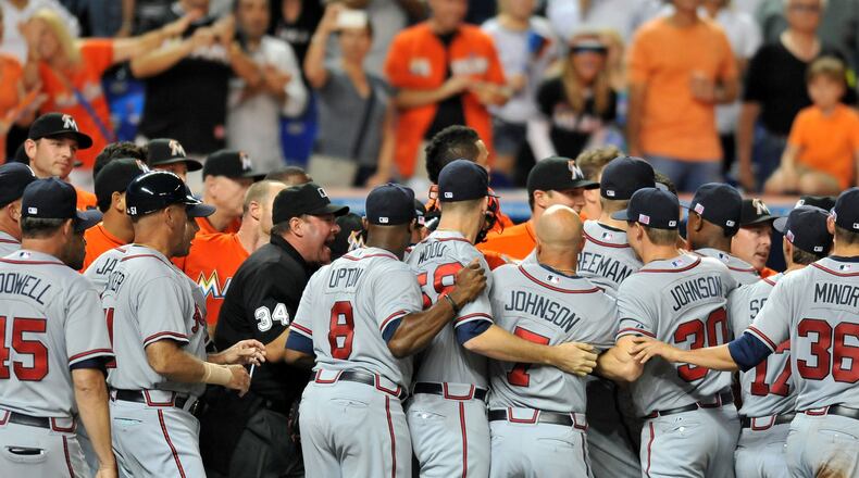 Sep 11, 2013; Miami, FL, USA; Atlanta Braves players have an altercation with Miami Marlins players at home plate after Marlins starting pitcher Jose Fernandez (not pictured) hit a solo home run during the sixth inning at Marlins Park. Mandatory Credit: Steve Mitchell-USA TODAY Sports