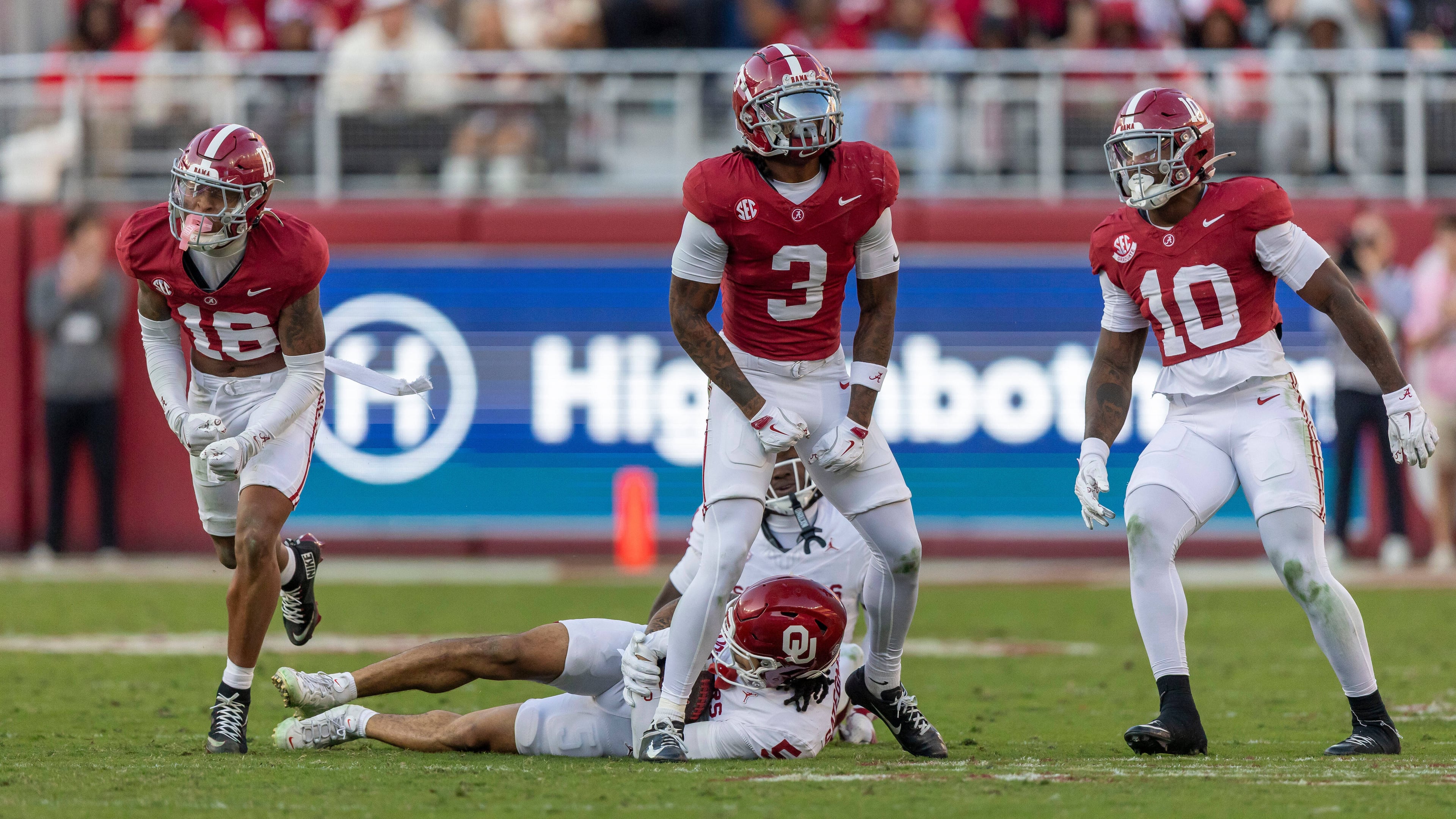 Alabama defensive backs Red Morgan (16) and Keon Sabb (3) and linebacker Justin Jefferson (10) celebrate a stop against Oklahoma during the first half of an NCAA college football game, Saturday, Nov. 15, 2025, in Tuscaloosa, Ala. (AP Photo/Vasha Hunt)