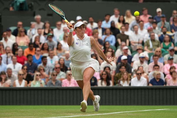 Russia's Anastasia Pavlyuchenkova returns to Sonay Kartal of Britain during a fourth round women's singles match at the Wimbledon Tennis Championships in London, Sunday, July 6, 2025. (AP Photo/Alastair Grant)