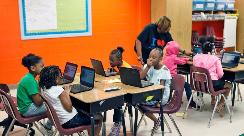 Atlanta Public Schools students gather in a third-grade computer coding class during the 2018 summer school program.  Bob Andres / bandres@ajc.com