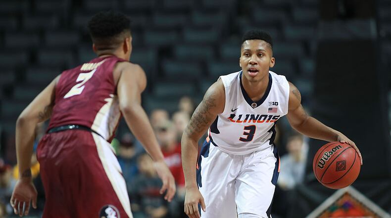 NEW YORK, NY - NOVEMBER 25: Te'Jon Lucas #3 of the Illinois Fighting Illini dribbles up court against CJ Walker #2 of the Florida State Seminoles in the first half during the consolation game of the NIT Season Tip-Off at Barclays Center on November 25, 2016 in the Brooklyn borough of New York City. (Photo by Michael Reaves/Getty Images)