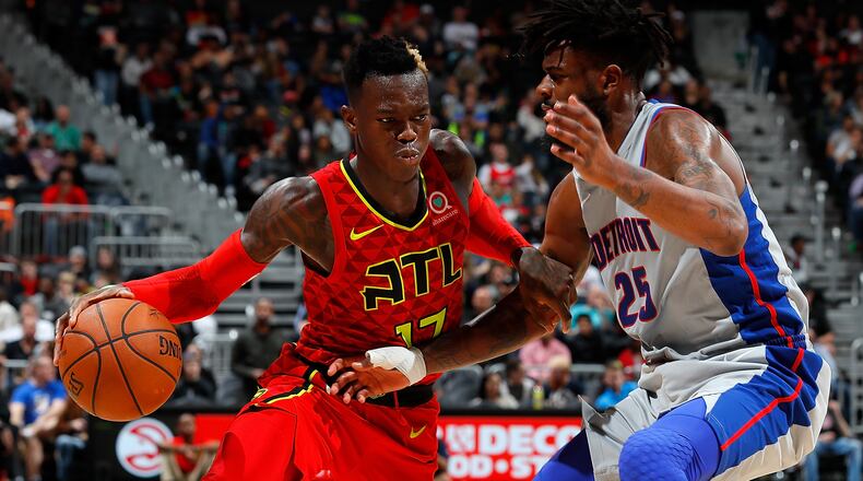 Hawks guard  Dennis Schroder drives against hte Pistons' Reggie Bullock at Philips Arena on Feb. 11, 2018 in Atlanta.