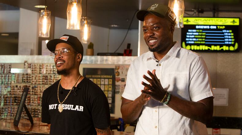 Skinny DeVille (left) and Fish Scales, members of the alternative rap group Nappy Roots, talk about the attack at Atlantucky Brewery.