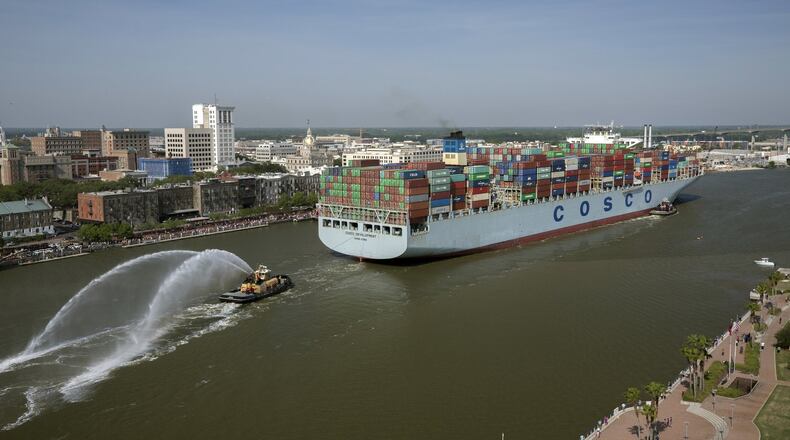 The container ship COSCO Development sails up river past the historic district of Savannah, Ga., to the Port of Savannah, on Thursday, May 11, 2017. At 1,201 feet long and 158 feet wide, the ship was at the time the largest vessel ever to call on the U.S. East Coast. (AP Photo/Georgia Ports Authority, Stephen Morton)