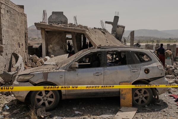 People inspect the damage of a building that reportedly was destroyed by U.S. airstrikes in Sanaa, Yemen, Monday, April 7, 2025. (AP Photo)