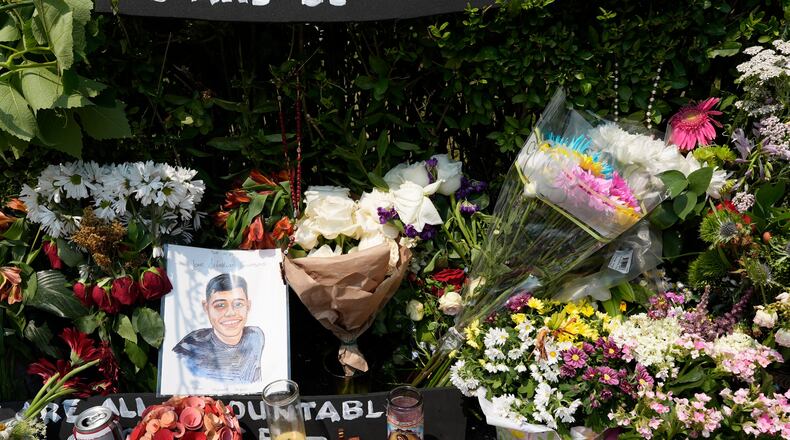 A portrait of Johan Sebastián Durán Guerrero, the man killed by U.S. Immigration and Customs Enforcement, is displayed among flowers and tributes at a makeshift memorial in Biddeford, Maine, Wednesday, July 15 2026. (AP Photo/Robert F. Bukaty)