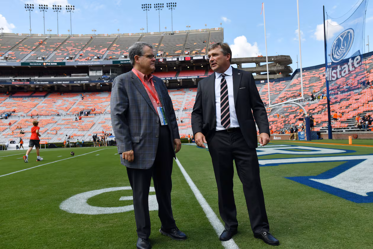 Georgia head coach Kirby Smart (right) talks with Georgia president Jere Morehead before their game against Auburn at Jordan-Hare Stadium, Saturday, Sept. 29, 2023, in Auburn, Alabama. (Hyosub Shin/AJC)