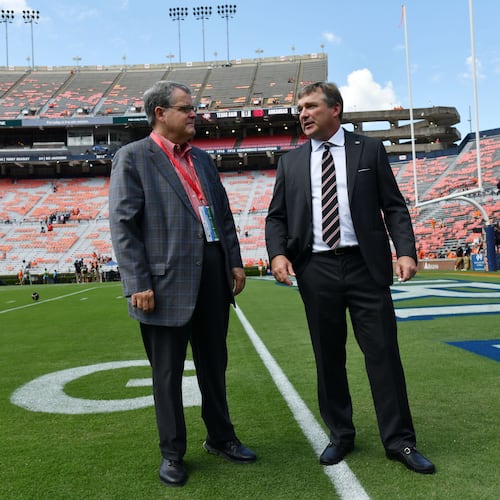 Georgia head coach Kirby Smart (right) talks with Georgia president Jere Morehead before their game against Auburn at Jordan-Hare Stadium, Saturday, Sept. 29, 2023, in Auburn, Alabama. (Hyosub Shin/AJC)