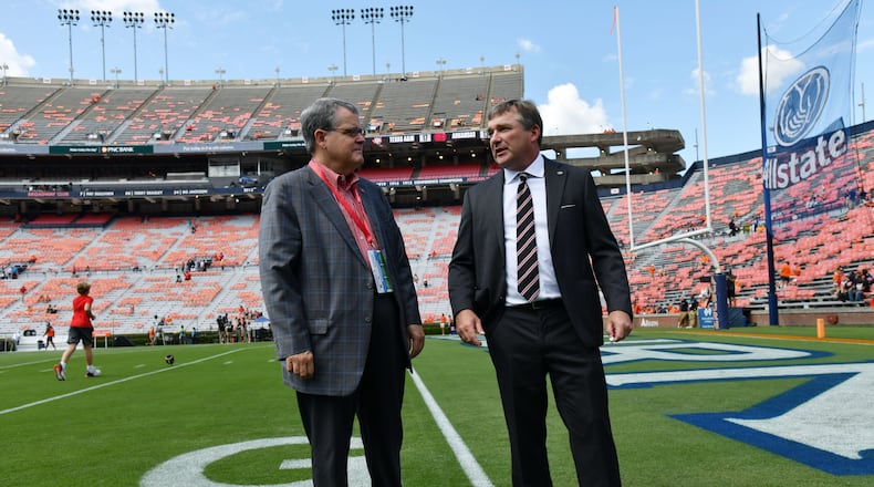 Georgia head coach Kirby Smart (right) talks with Georgia president Jere Morehead before their game against Auburn at Jordan-Hare Stadium, Saturday, Sept. 29, 2023, in Auburn, Alabama. (Hyosub Shin/AJC)
