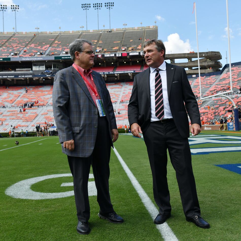 Georgia head coach Kirby Smart (right) talks with Georgia president Jere Morehead before their game against Auburn at Jordan-Hare Stadium, Saturday, Sept. 29, 2023, in Auburn, Alabama. (Hyosub Shin/AJC)