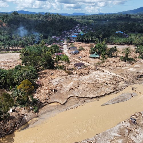 FILE - This aerial photo taken using drone shows a village affected by a flash flood in Batang Toru, North Sumatra, Indonesia, on Dec. 1, 2025. (AP Photo/Binsar Bakkara, File)
