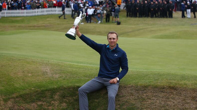 FILE - Jordan Spieth of the United States holds the trophy after winning the British Open Golf Championships at Royal Birkdale, Southport, England, July 23, 2017. (AP Photo/Dave Thompson, File)